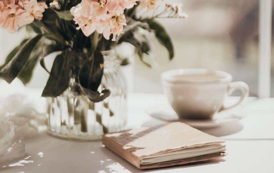 book on table with vase